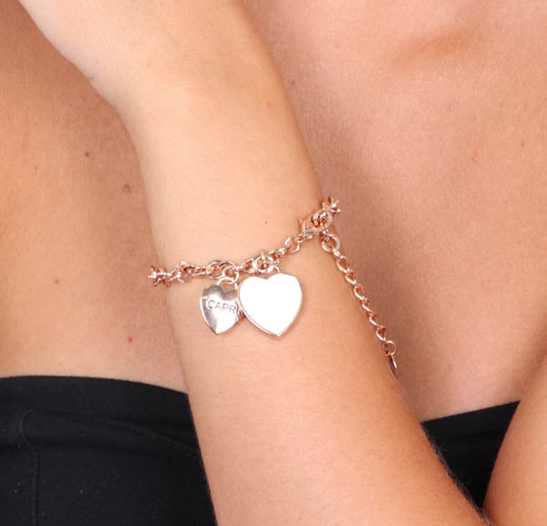 Metal bracelet with pendant heart, embellished with white enamel