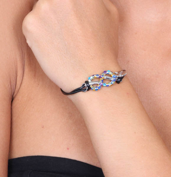 Metal bracelet in Caucciu, with an infinite symbol embellished with multicolored crystals