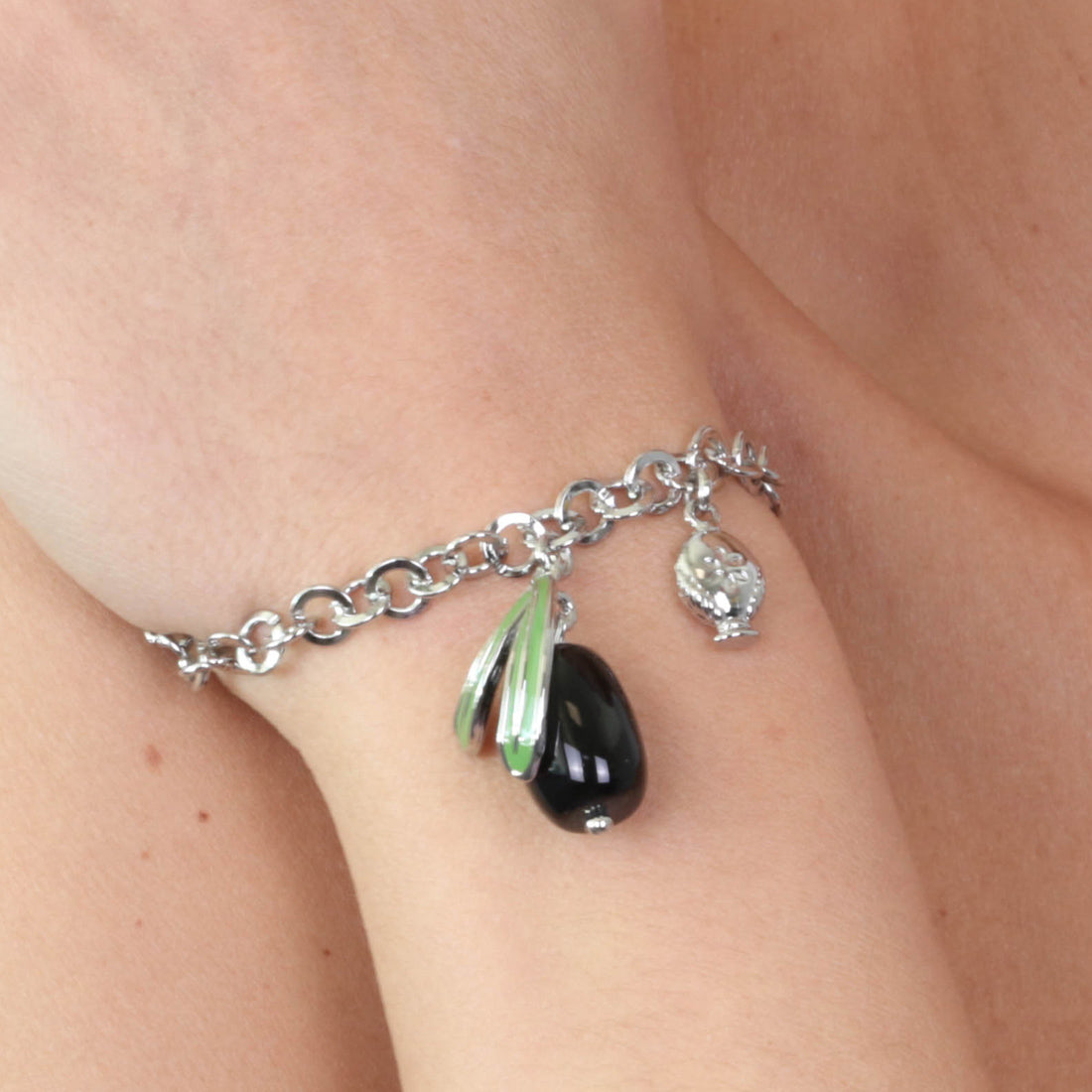 Metal bracelet with pendant olive embellished with colored enamels and mini pumo on the side