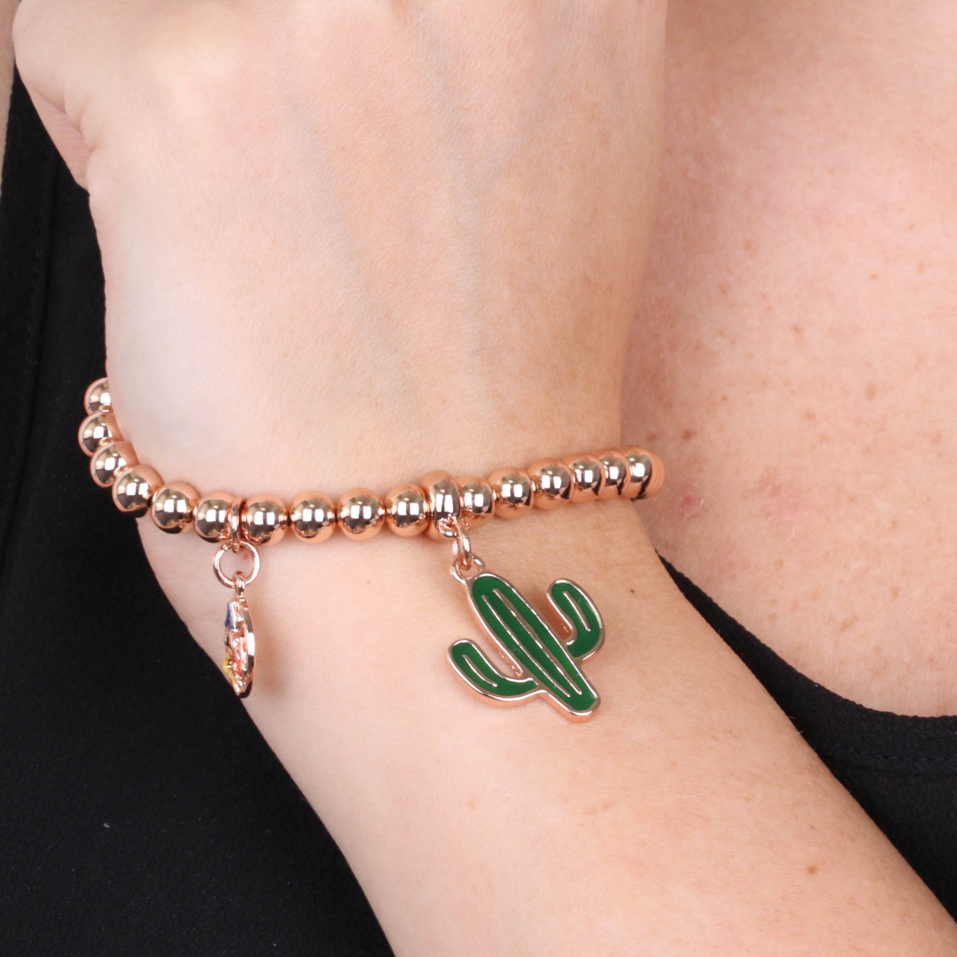 Metal bracelet spheres, with pending cactus embellished with green enamel