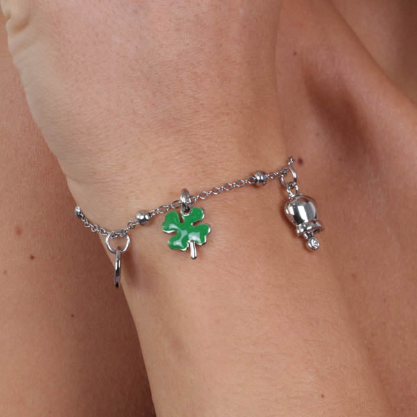 Metal bracelet with bell and four -leaf clover in green enamel