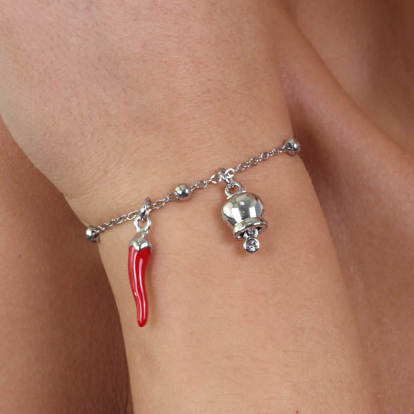 Metal bracelet with bell and red enamel horn