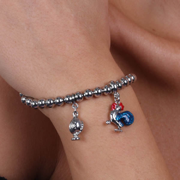 Metal bracelet with pendant rooster embellished with colored enamels and mini pendant pumo
