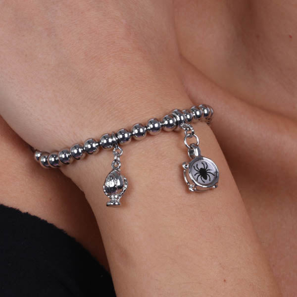 Metal bracelet with drum and mini pendant pumo