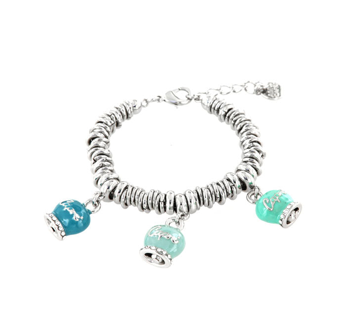Metal bracelet with trio of bells blue luck