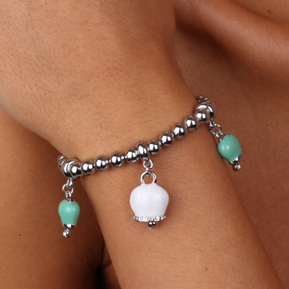 Metal bracelet with silver spheres, white and green bells with crystals