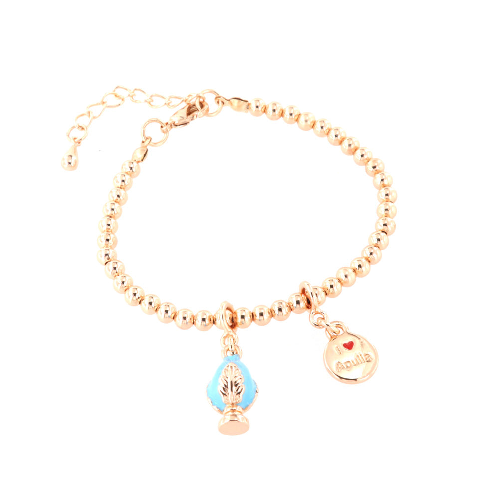 Metal bracelet with Apulian pumo pendant embellished with blue enamel