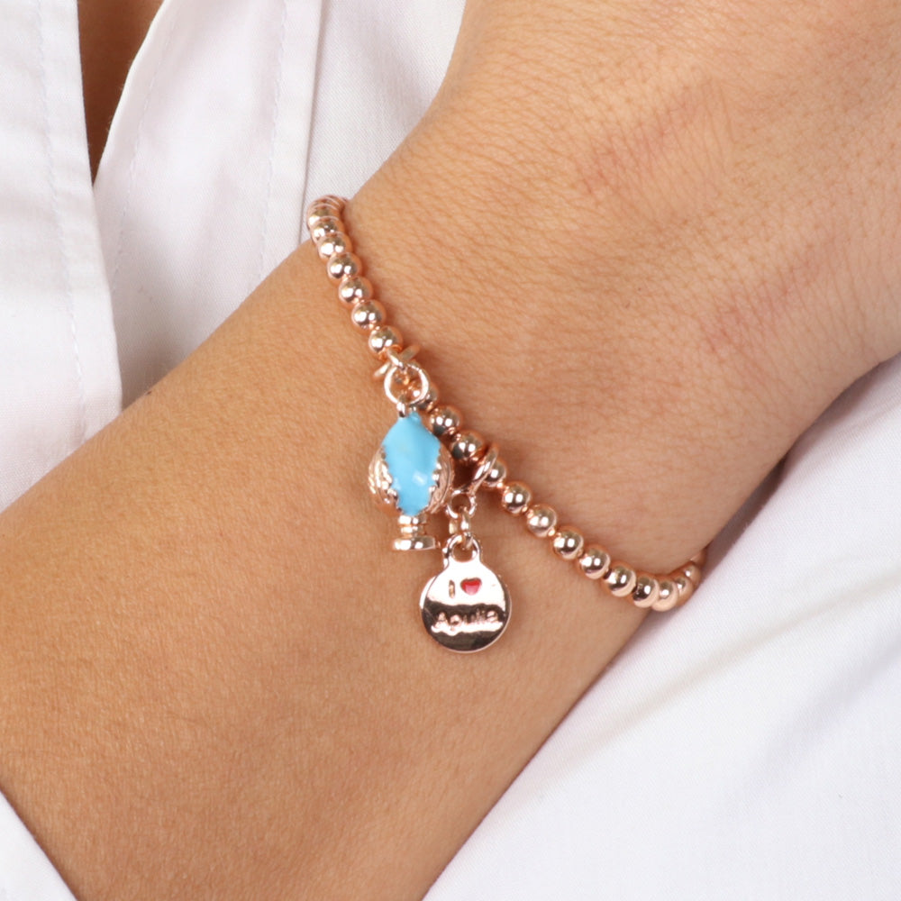 Metal bracelet with Apulian pumo pendant embellished with blue enamel