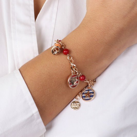 Metal bracelet with orange bell, stripes and red coral medallions