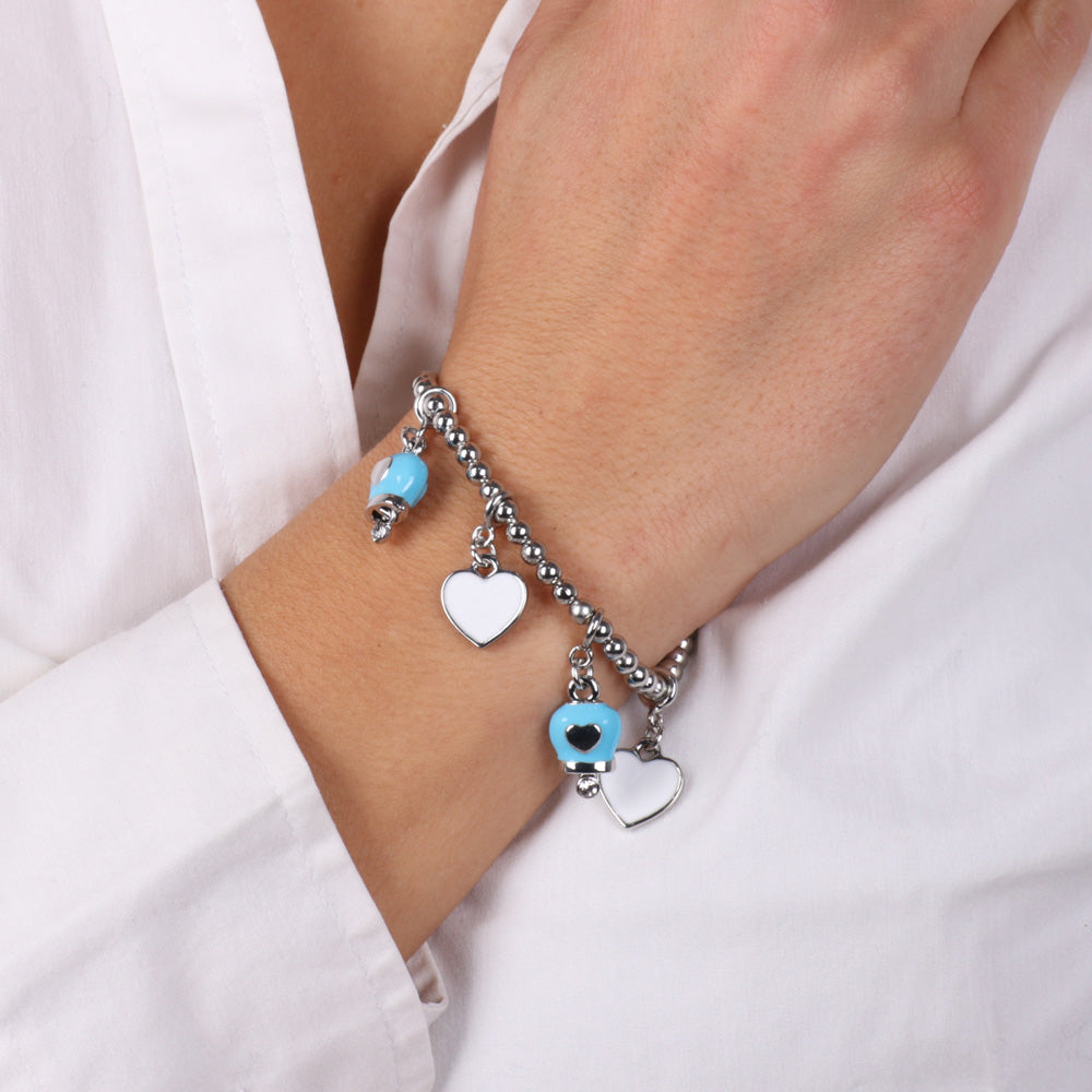Metal bracelet with pending pendants in the shape of a heart and bell embellished with white and turquoise nail polish