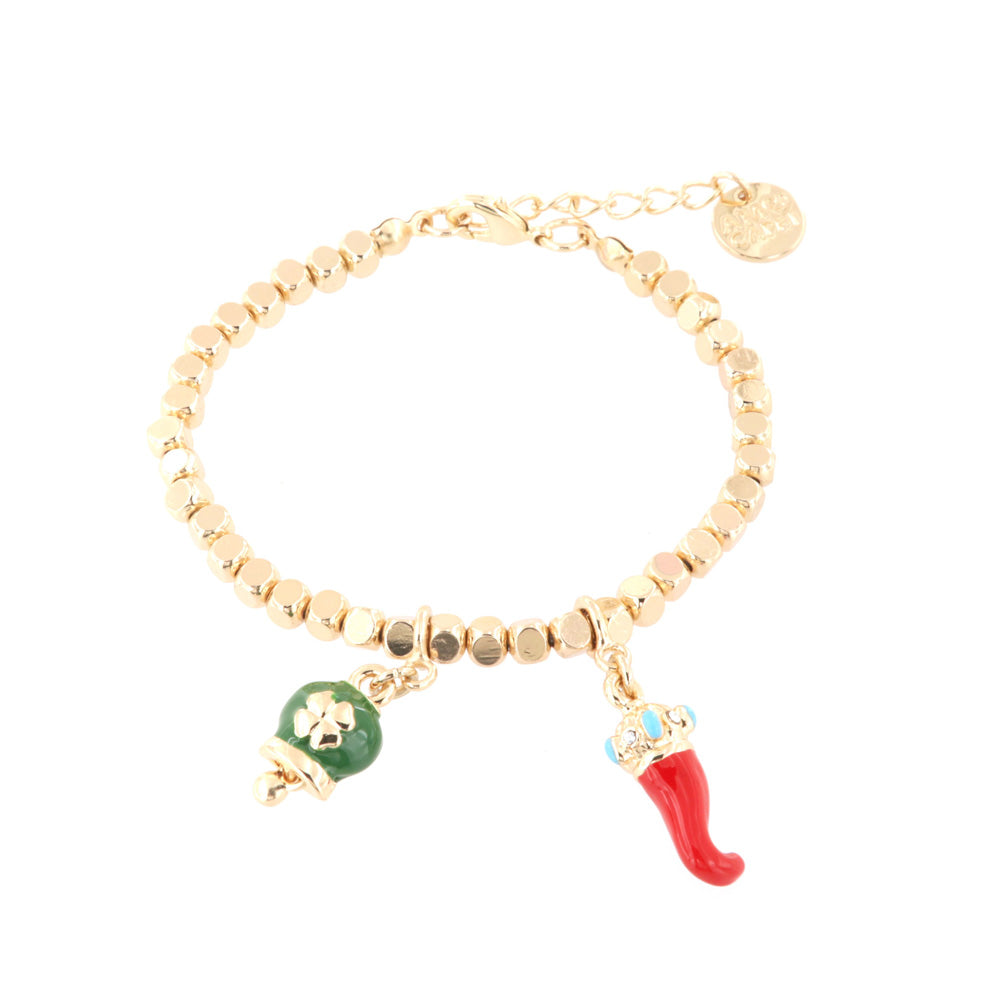 Metal bracelet with lucky charging pendants, green glazed bell and red enamel horn