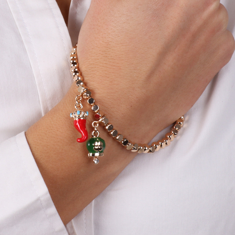 Metal bracelet with lucky charging pendants, green glazed bell and red enamel horn