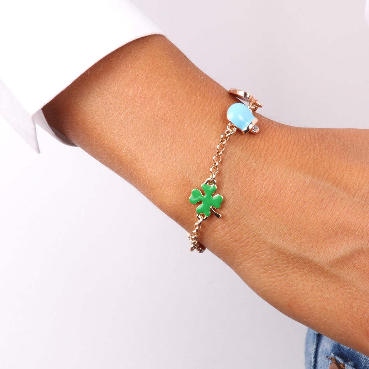 Metal bracelet with four -leaf clover, charming bell, heart with Capri and rainbow