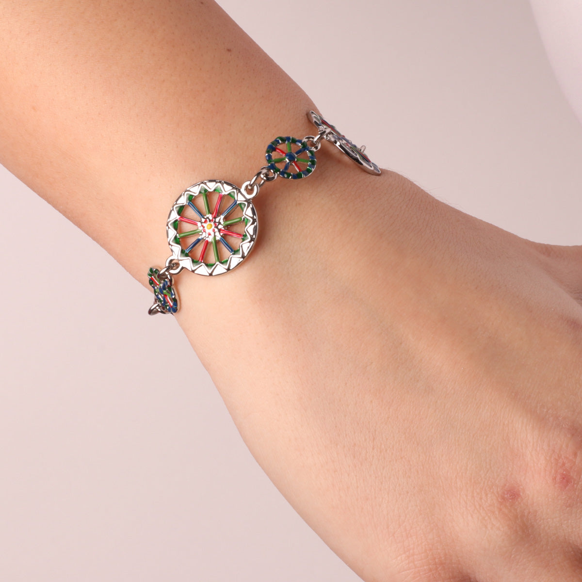 Metal bracelet with wheels of the Sicilian cart embellished with colored glazes