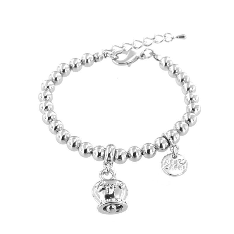 Metal bracelet spheres shirt, with pendant capri written bell, embellished with crystals