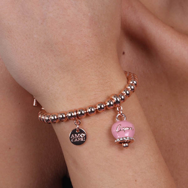 Metal bracelet spheres shirt, with written bell capri pendant embellished with crystals and pink enamel