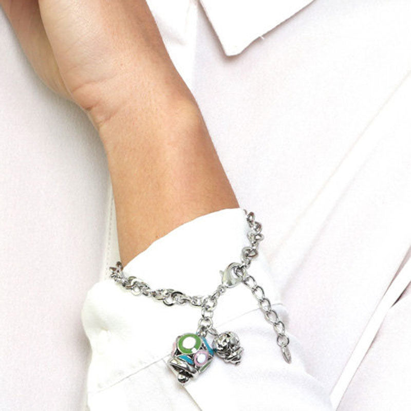 Metal bracelet with colored bell and small bell with hearts