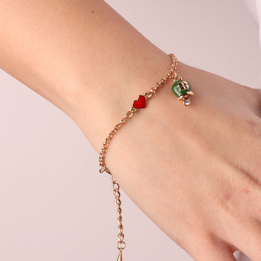 Metal bracelet with heart and green charcoal bell with quadrifoglio