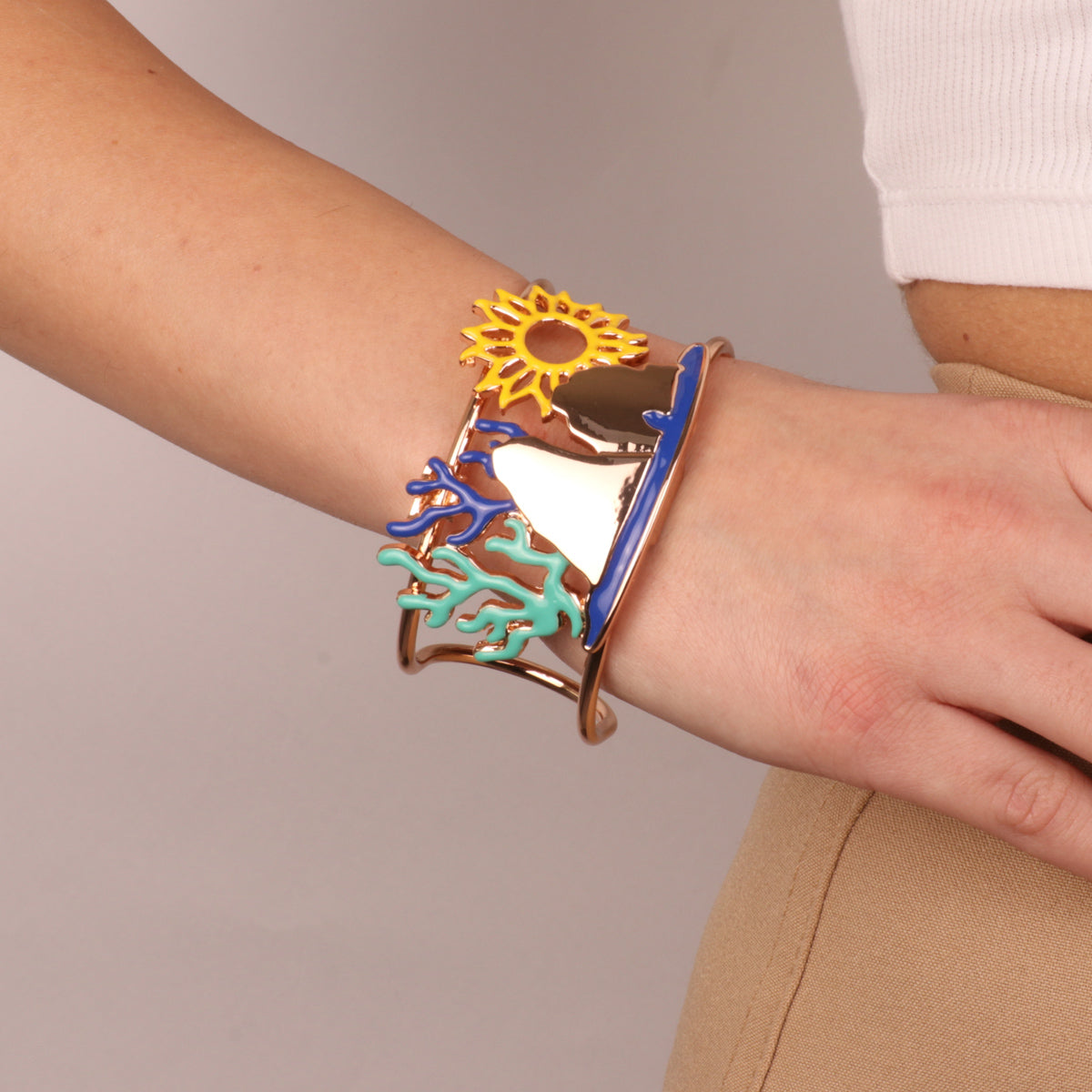Metal bracelet with faraglioni, sun and corals