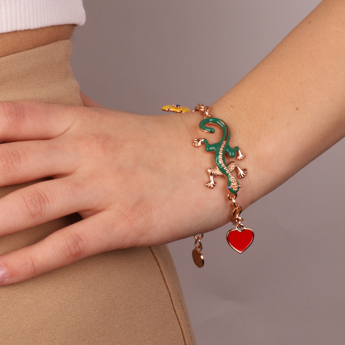Metal bracelet with green geco, red heart and yellow flower