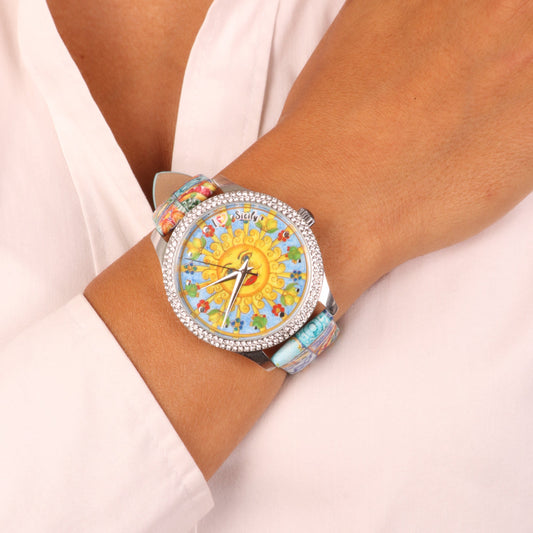 Analog metal watch dial with Sicilian sun and symbols, strap with majolica